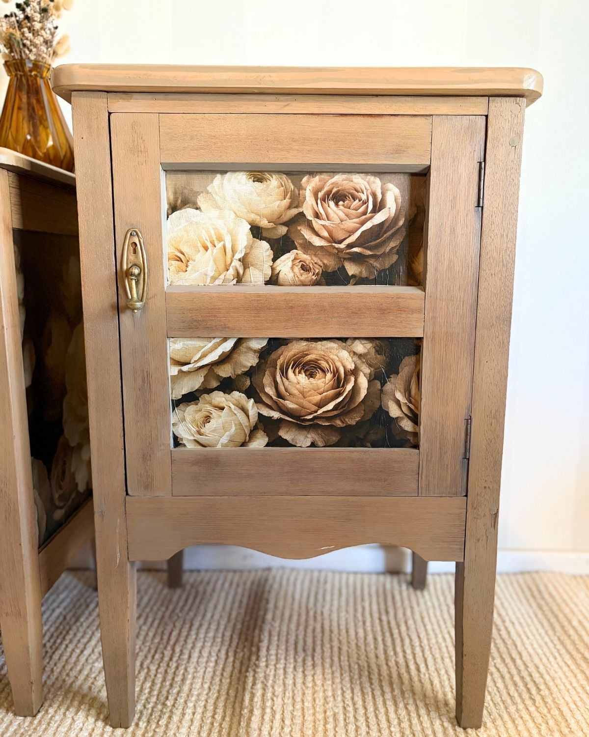 Taller antique hardwood bedside table with floral panels and original brass hardware
